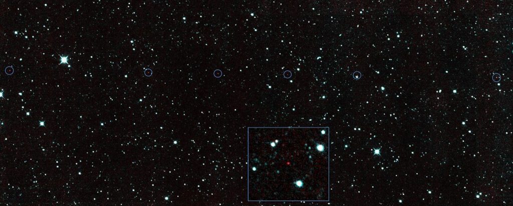 Survey Telescopes Get Better at Spotting Small Asteroids Early rocky asteroid set against a starry background
